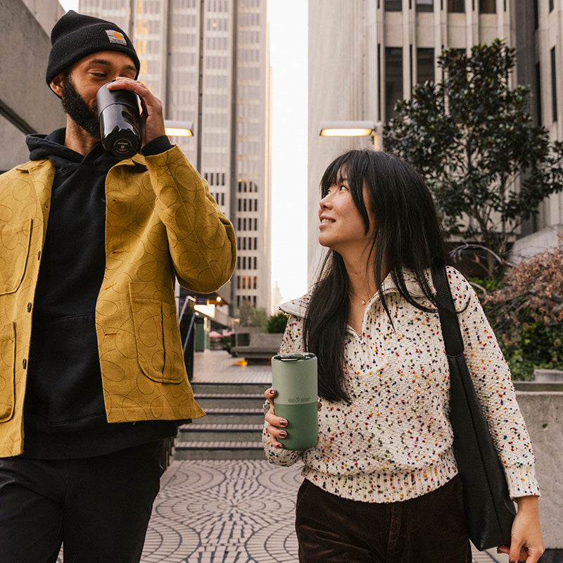 bring-your-own-party-kit-pints-and-tumblers-y3 16oz_rise_tumbler_black_iceberg_couple_drink_city_street_square.jpg
