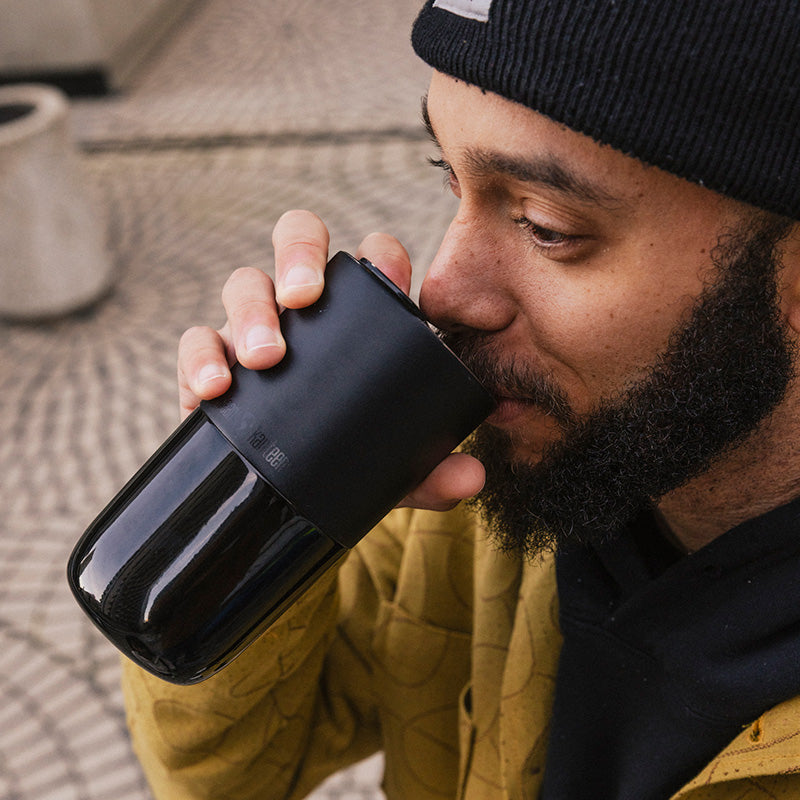 daily-on-the-go-set-u8 16oz_rise_tumbler_black_man_drink_square.jpg
